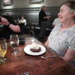 Julia with Kelsey's chocolate caramel  tart a la mode and birthday candle at Fortify Restaurant in Clayton, GA, August 8, 2019