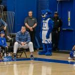 AD Charlie Cobb looks on as Pounce stands guard nearby