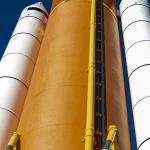 Space shuttle orange fuel tank and white solid fuel boosters at Kennedy Space Center